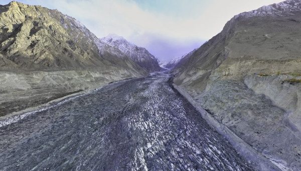 Hooper Valley in Hunza with lush fields, snow peaks, and the Baltoro Glacier