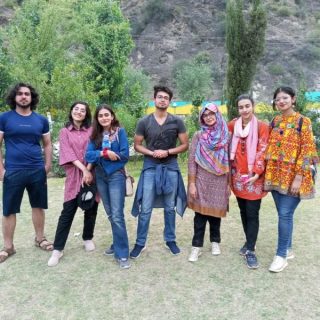 Corporate team engaged in outdoor experiential learning and leadership development activities