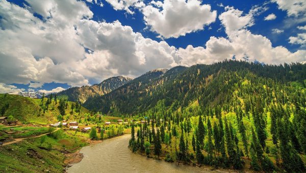 Beautiful Taobat village in Neelam Valley, Azad Kashmir with wooden houses, green hills, and a clear flowing river
