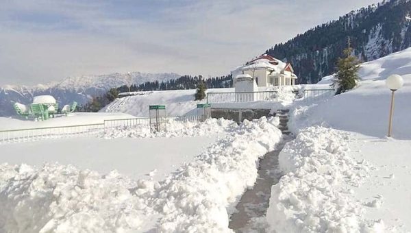 Pir Chinasi hilltop in Muzaffarabad, Azad Kashmir with panoramic mountain views, green hills, and the famous Sufi shrine