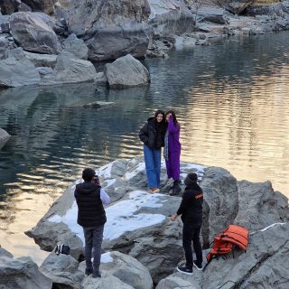 Crystal-clear waters of Upper Kachura Lake surrounded by lush mountains in Skardu