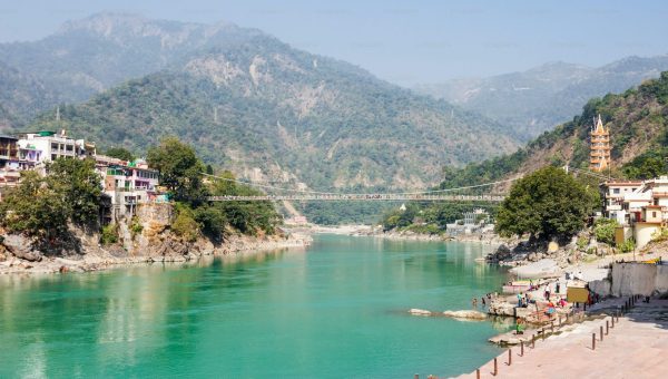 Panoramic view of Naran Valley surrounded by lush green mountains, alpine meadows, and flowing Kunhar River in Kaghan Valley, Pakistan
