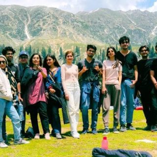 Group of people bonding during a reconnect retreat in a peaceful outdoor setting